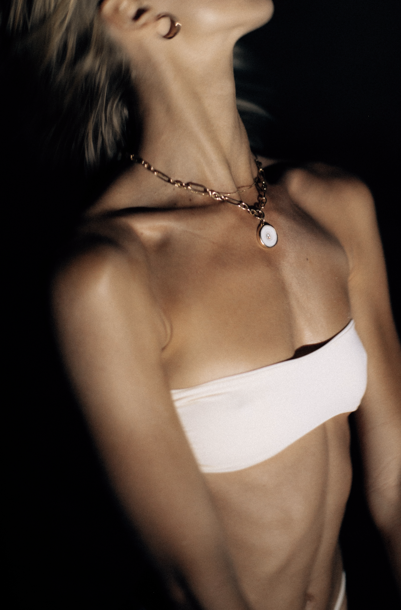 woman photographed during the full moon wearing a necklace by pukka perri